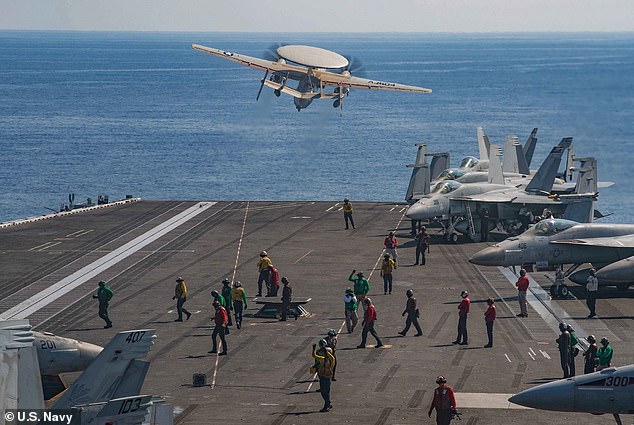 A Hawkeye spy plane is launched from the flight deck of the world's largest aircraft carrier USS Gerald R. Ford