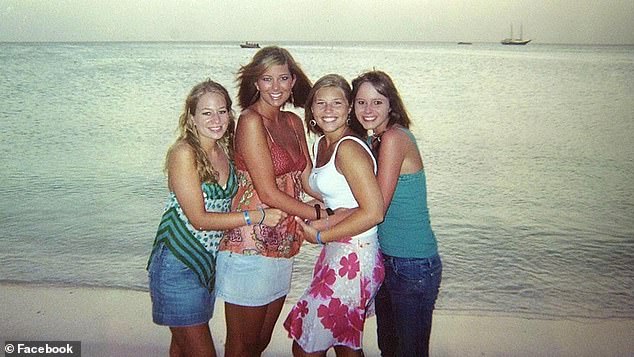 Natalee Holloway, left, poses with friends Lee Broughton, Madison Whatley and Ruth McVay, left to right, in a photo taken with Natalee's disposable camera on the beach in Aruba