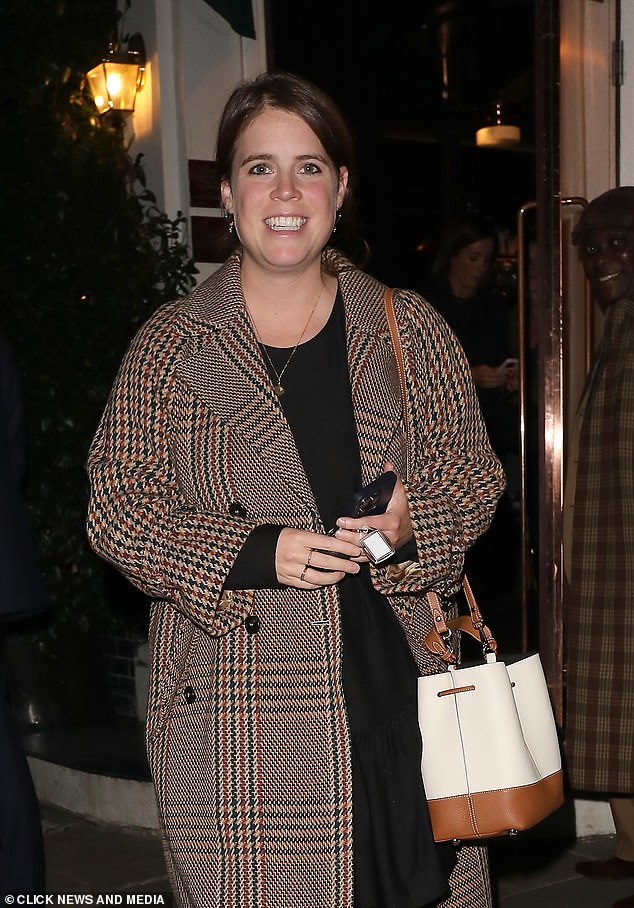 Eugenie bundled up against the autumn chill in her trusty MaxMara coat, which she debuted last winter