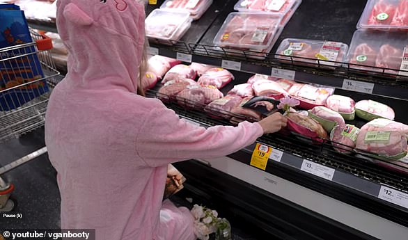 She decorated the area with roses before bowing her head in respectful silence as she played sounds of animals being slaughtered on a loudspeaker.