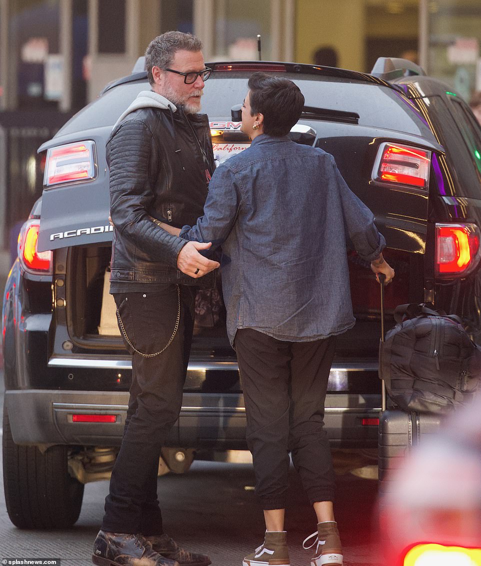 Stylish man: Dean wore a edgy leather jacket and black jeans with chain detailing