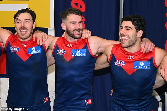 Smith (pictured, centre) was tested on August 20 after the Demons defeated Hawthorn at the MCG