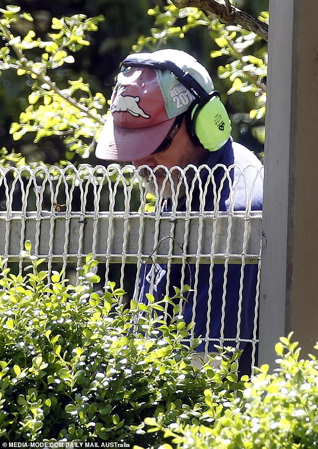 The radio star was seen trimming the hedge of a property he owns in the Dandenong Ranges