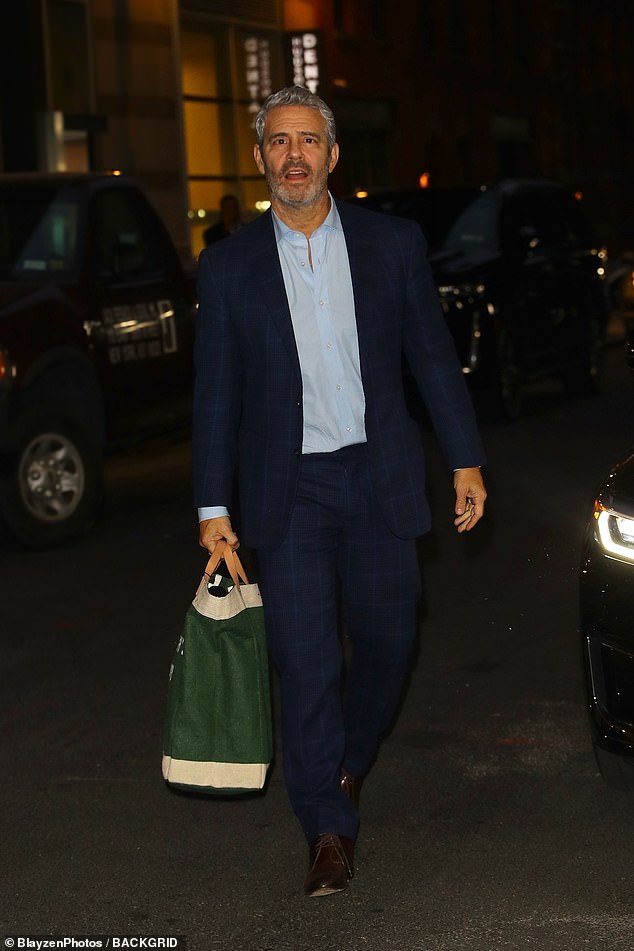 Dapper: Presenter Andy Cohen, 55, was also pictured leaving the studio after filming.  The executive producer of the Real Housewives franchise and VVHL wore a navy suit over a blue button down.