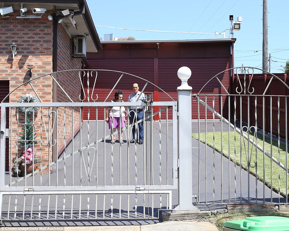 The otherwise unremarkable one-story red brick on a quiet suburban street makes locals and passersby scratch their heads wondering why anyone would need so much security