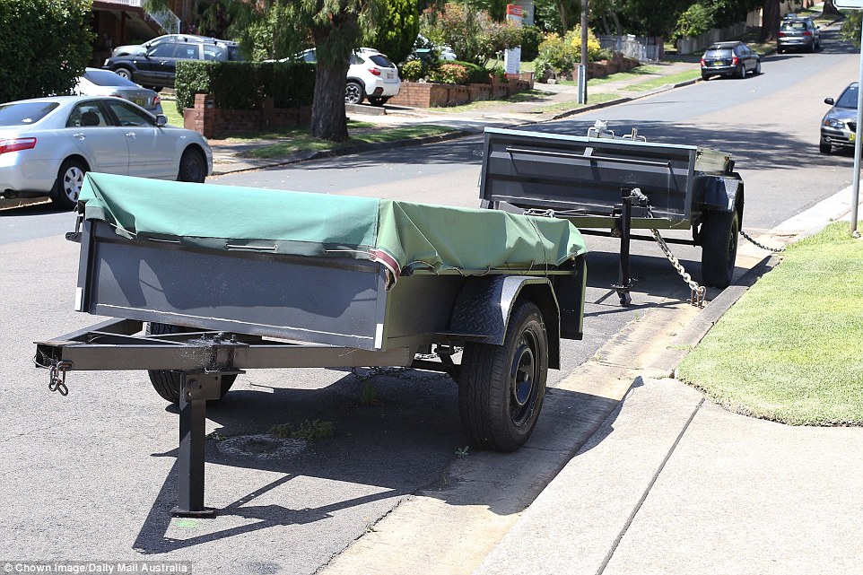 Even their two trailers parked outside on the street are completely locked and chained together