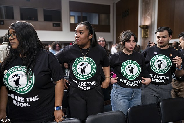 The Starbucks union represents approximately 9,000 employees across 340 stores.  Pictured here are union members in Washington, DC in March 2023 after watching company founder Harold Schultz testify before Congress