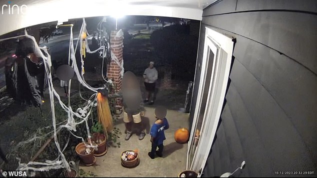 The children were apparently directed by one adult when two baskets filled with Halloween-themed items were stolen, while another adult also stood guard on the sidewalk.