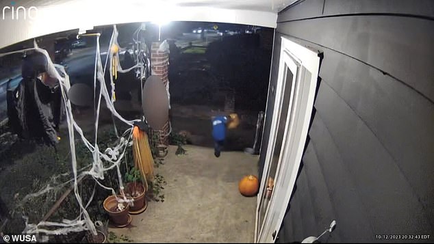 The children were seen inspecting Halloween decorations on the porch before two of them picked up baskets.  They immediately ran from the scene with the two adults
