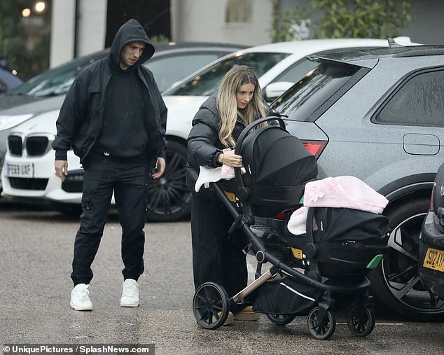 Helping Hand: Jarrod pulled back and watched Dani put the babies in the car