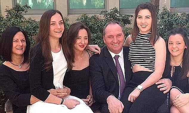 Mr Joyce is pictured with his ex-wife Natalie and their four daughters, Julia, Caroline, Odette and Bridgette