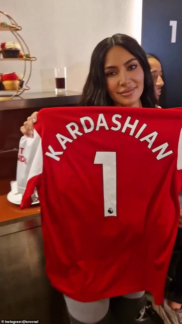 Kardashian posed wearing an Arsenal shirt with her name on the back as she took her son Saint to a match at the Emirates Stadium in March 2023.