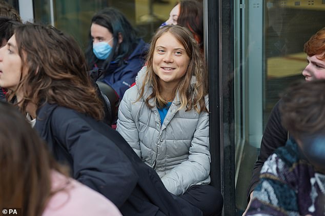 Swedish activist, 20, has joined a protest outside JP Morgan demanding the bank stop financing fossil fuels