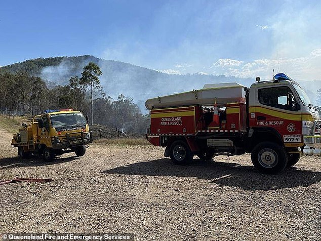 With one home destroyed, Queensland Fire and Emergency Services warned it was still not safe for people to return as firefighters continued to battle the blaze.  QFES vehicles shown