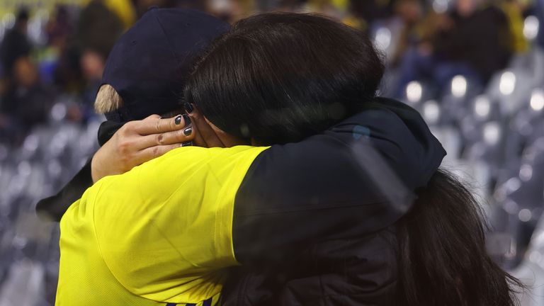 Swedish fans at King Baudouin Stadium react after Sweden's Euro 2024 qualifier against Belgium was abandoned following a shooting in Brussels