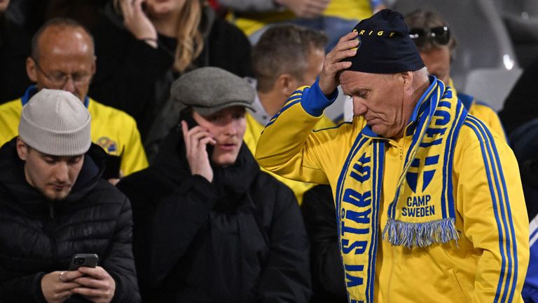 Swedish fans at King Baudouin Stadium react after Sweden's Euro 2024 qualifier against Belgium was abandoned following a shooting in Brussels