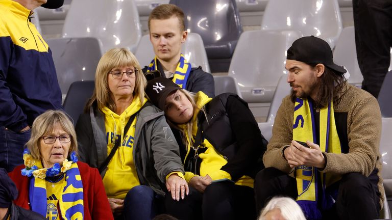 Swedish fans at King Baudouin Stadium react after Sweden's Euro 2024 qualifier against Belgium was abandoned following a shooting in Brussels