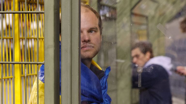 A Swedish fan at the King Baudouin Stadium reacts after Sweden's Euro 2024 qualifier against Belgium was abandoned following a shooting in Brussels