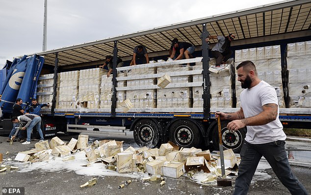 The demonstrators smashed several crates of Freixenet bottles