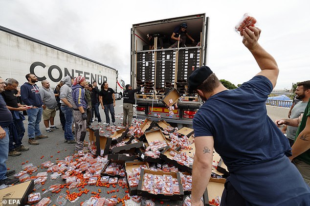 Protesters even grabbed individual packages of tomatoes and threw them on the ground