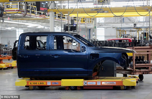 Tesla faces competition from a growing group of competitors, including Ford.  A cab of a model of the all-new F-150 Lightning electric pickup is seen on an assembly line at the Ford Rouge Electric Vehicle Center in Dearborn, Michigan, U.S., April 26, 2022