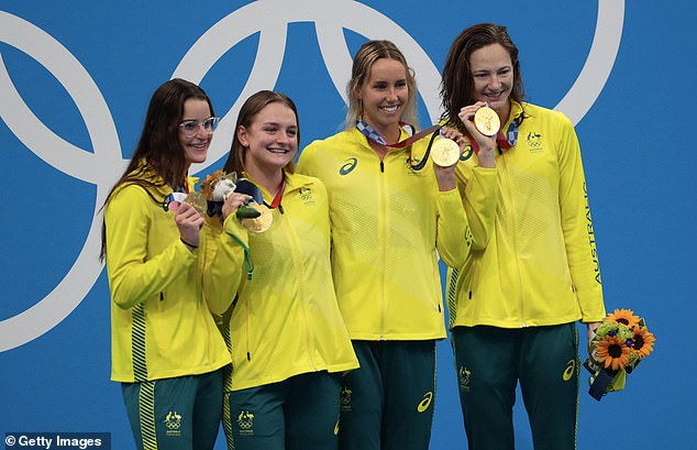 Gold medalist Kaylee McKeown, Chelsea Hodges, Emma McKeon and Cate Campbell pose at the Tokyo Olympics