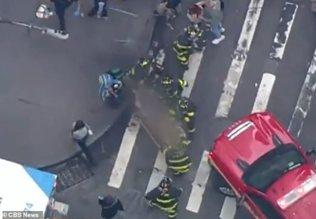 The woman suffered an unspecified head injury after being pushed by Jones as a train left the platform before falling onto the tracks.  She was rescued by several good Samaritans, officers said at a news conference at the station later that afternoon