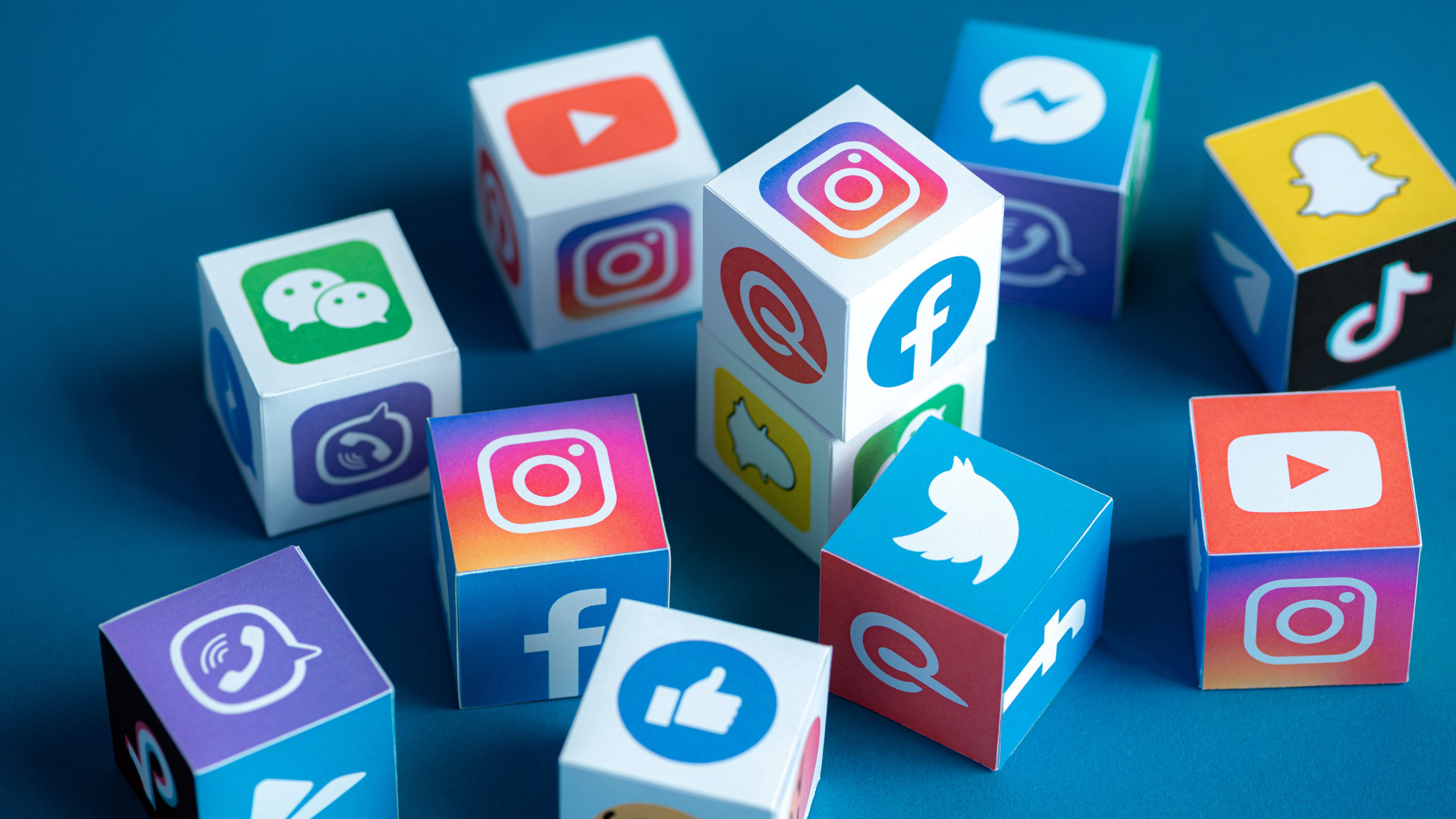 A group of cubes all with social media logos