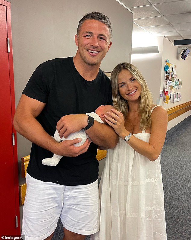 NRL star Sam Burgess announced the arrival of his first child with fiancee Lucy Graham on Friday.  Pictured with Lucy and daughter Robbie