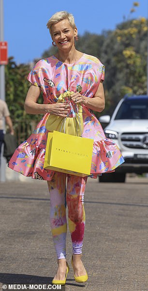 Jessica Rowe made a style statement in a playful pink gown paired with rainbow leggings and a bright yellow pair of stilettos and matching handbag