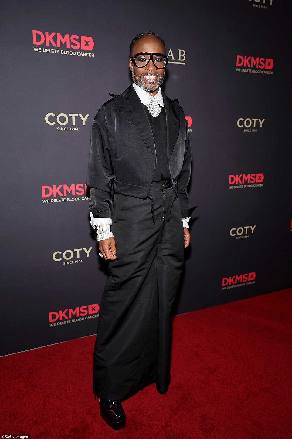 Unique: Pose star Billy Porter, 54, showed off his unique style in a black jacket worn over a matching top and skirt