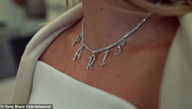 Paris: They hinted they've already picked a name for their daughter by wearing matching 'Paris' necklaces