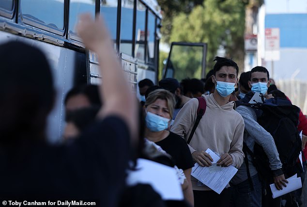 The Iris Ave Transit center in Otay Mesa West, where these migrants were pictured, has seen up to 1,200 new arrivals each day