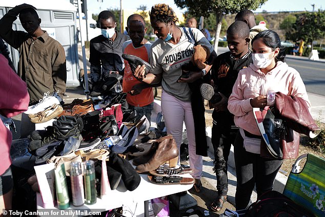 Migrants at the Iris Ave transit center are offered clothing and personal care items to take with them