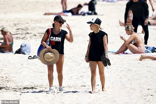 Arriving at the iconic Sydney beach, Stines wore a black top and wide-brimmed hat