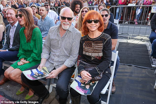 They show their love!  Reba was joined by her boyfriend, Rex Lynn