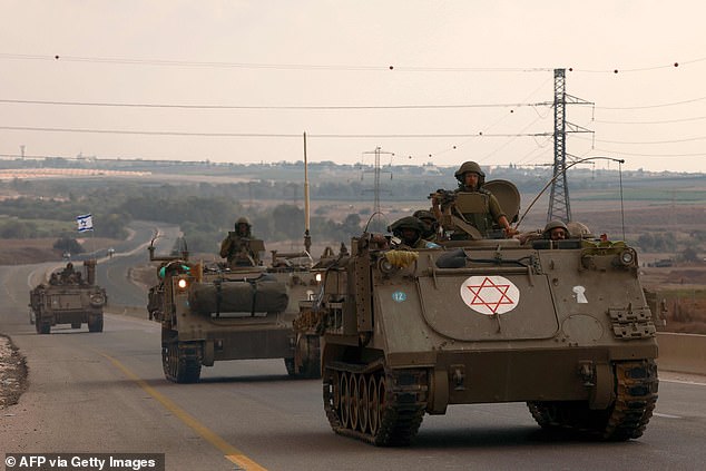 Israeli soldiers drive their armored vehicles towards the Gaza Strip border on October 16, 2023, amid ongoing fighting between Israel and the Palestinian group Hamas