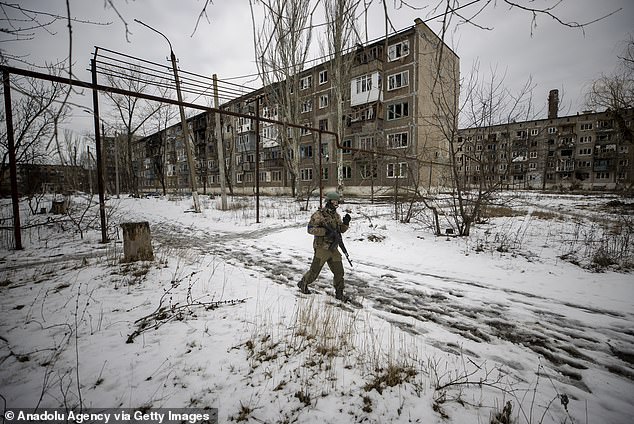 Ukrainian soldiers patrol after a Russian military attack in Ugledar, Donetsk Oblast, Ukraine on February 19, 2023