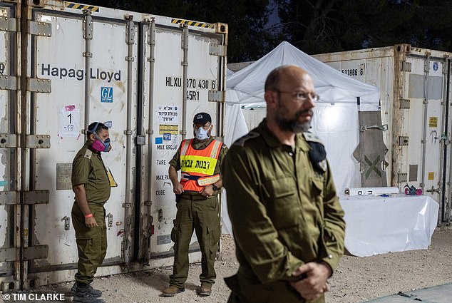 Colonel Rabbi Haim Weisberg (photo, front) said: 'We have already identified the bodies of 800 people and we are working on another 500'