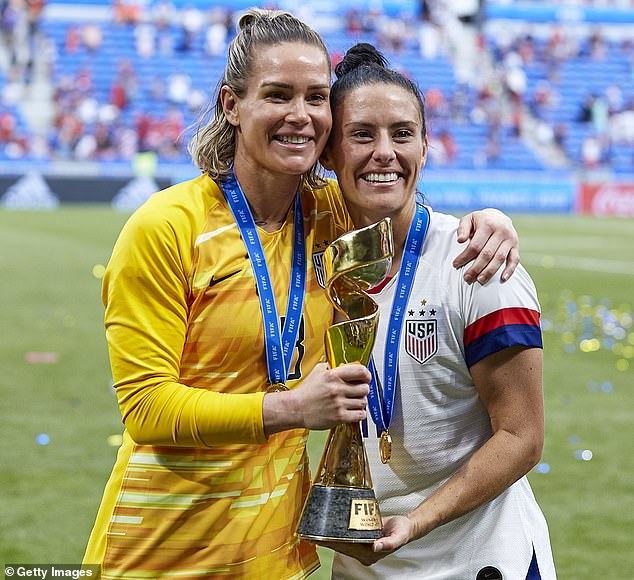 Krieger won the World Cup twice with the USWNT and played a total of 108 times for the US - here she is pictured with ex-wife and ex-US international player Harris (left)