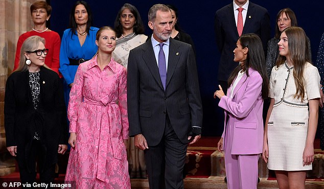 Queen Letizia talks to King Felipe as their daughters and Meryl, far left, look on