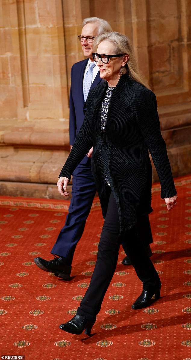 Best foot forward: Meryl steps into the medal ceremony looking sharp in a smart black pantsuit