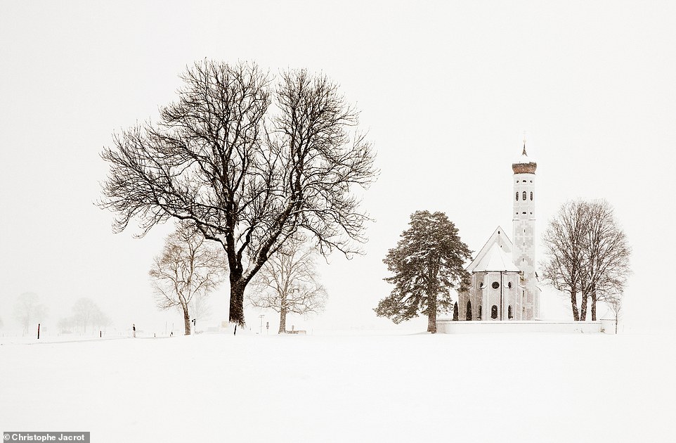 This enchanting photo shows the landscape around St. Coloman's Church in Bavaria, Germany, covered in snow