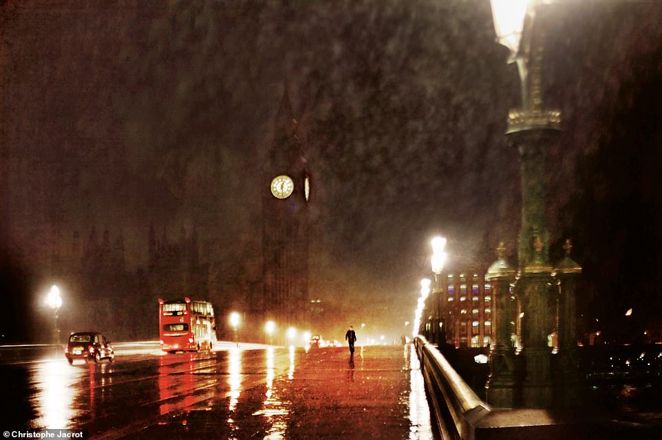 This moody shot shows London, with Big Ben glowing in the distance, on a rainy evening.  Jacrot writes: 'When it rains heavily, the light is unique and beautiful, but I feel like I'm the only one who notices it as I watch everyone else run for cover'