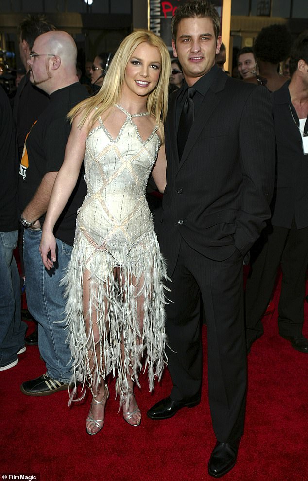 Dropping it: Britney revealed she was just 14 when she lost her virginity to her older brother's 17-year-old best friend Brian Spears;  pictured with Brian in 2003