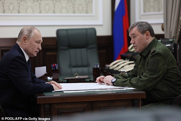 Russian President Vladimir Putin, accompanied by Army Chief of Staff Valery Gerasimov, visits the military headquarters in Rostov-on-Don that oversees the country's military action in Ukraine, on October 19, 2023