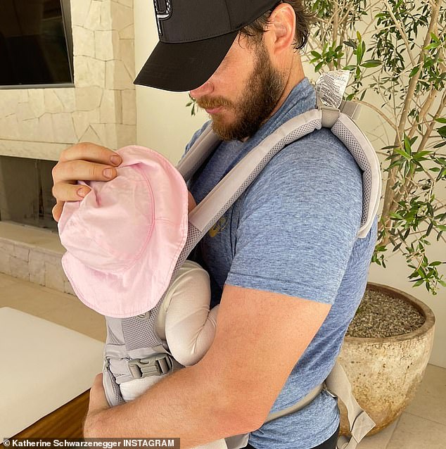 Dad and daughter: The Hollywood hottie married in 2019 and are now proud parents to two daughters, Lyla, three, and Eloise, one;  Chris is pictured with Eloise