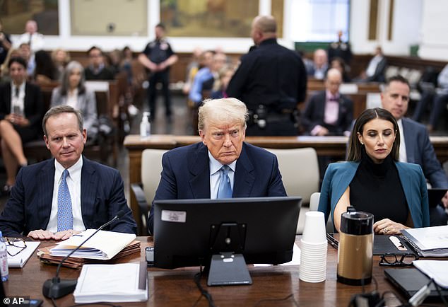 Trump in court with his lawyers earlier this week.  He did not return to court today