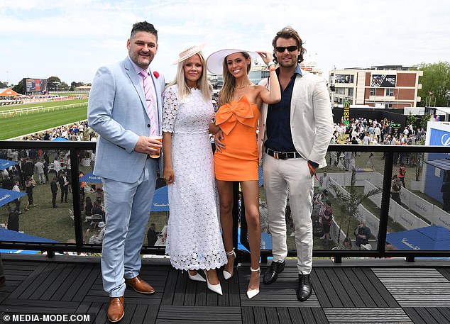 AFL legend turned radio identity Brendan Fevola (pictured left) enjoyed himself with his wife Alex in the VIP section
