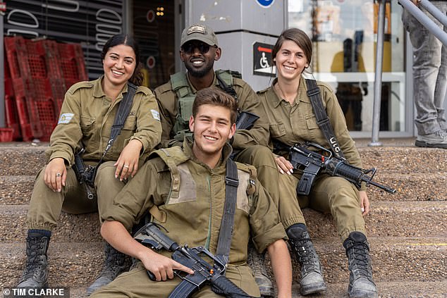 The Israeli Reserve Army near Gaza takes a break from their duties to relax and grab food before returning to their duties in the area.  Photo shows: (L-R back row) Alice, 20, Avrama, 21 Ali, 21 all from Jerusalem, and front Shoham, 21